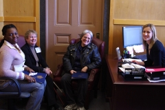 Kay, Jini and Bonnie speak with Marianne Conboy, aid to State Senator Karen Spilka