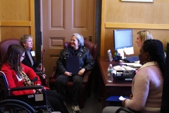 Amy, Jini, Bonnie and Kay speak with Marianne Conboy, aid to State Senator Karen Spilka