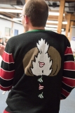 back of Sebatian's Ugly Sweater with reindeer pooping hershey kisses