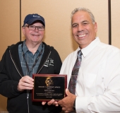 Stephen Higgins presents David Correia with 2019 NCIL Advocacy Region I Award
