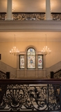 State House stairway with stained glass and ornate railings