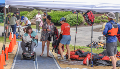 woman in wheelchair gets ready to kayak