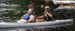 Tammy (former MWCIL Board member) in kayak, with HUGE grin