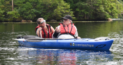 Kayaker speaking sign language