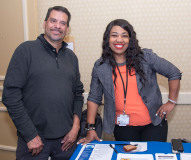 MCDHH Table - Man and woman at the exhibitor table