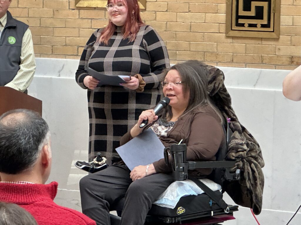 Nancy (MASILC and CLW) speaks with Brianna Zimmerman (STAVROS) in background